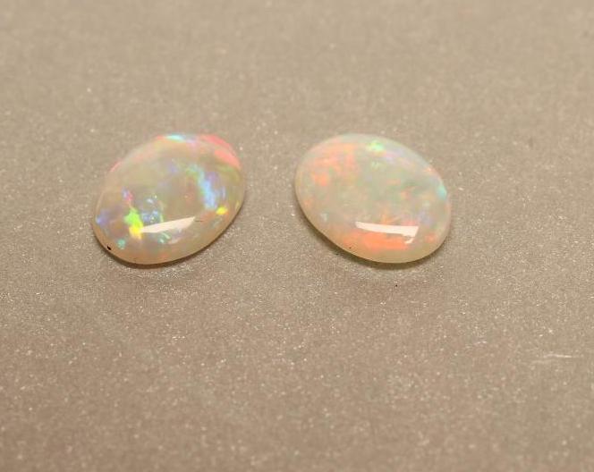 A PAIR OF UNMOUNTED OPALS Image