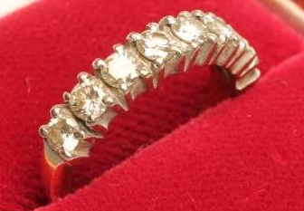 AN EIGHT STONE DIAMOND HALF HOOP ETERNITY RING Image