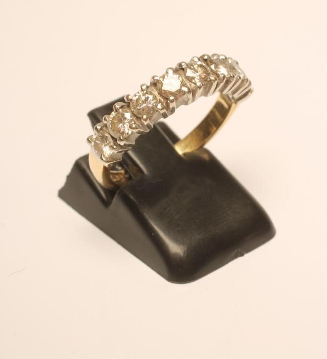 AN EIGHT STONE DIAMOND HALF HOOP ETERNITY RING Image