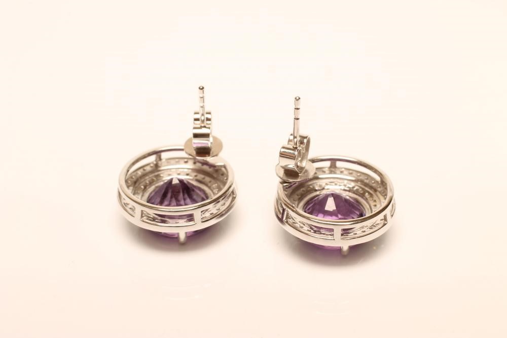 A PAIR OF AMETHYST AND DIAMOND EAR STUDS Image