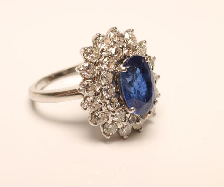 A SAPPHIRE AND DIAMOND CLUSTER RING Image