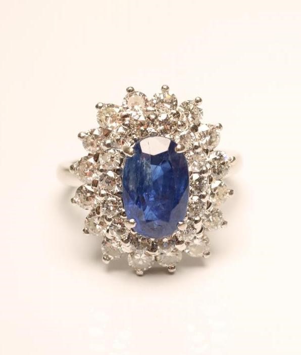 A SAPPHIRE AND DIAMOND CLUSTER RING Image
