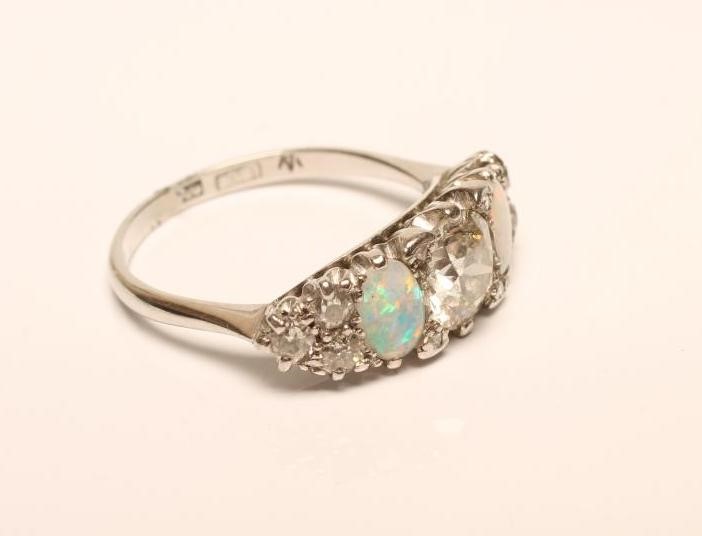 A DIAMOND AND OPAL RING Image