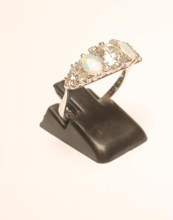 A DIAMOND AND OPAL RING Image