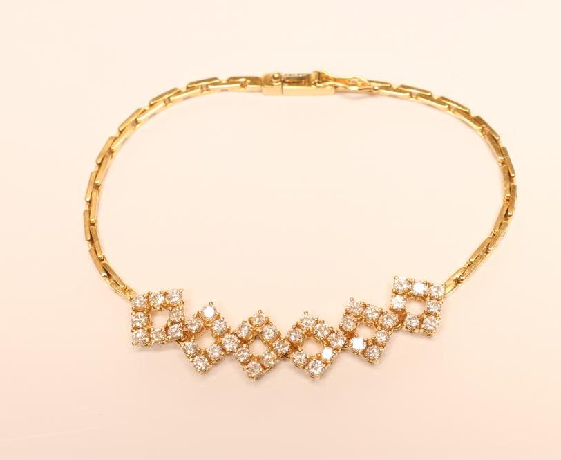A BRACELET to match the previous lot with six diamond set panels Image