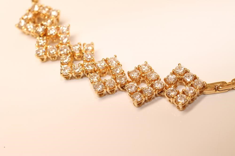 A BRACELET to match the previous lot with six diamond set panels Image