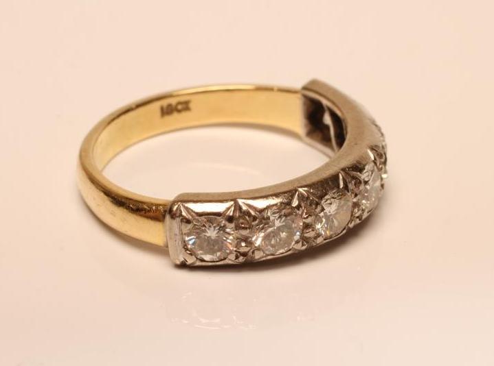 A SEVEN STONE DIAMOND HALF HOOP ETERNITY RING Image