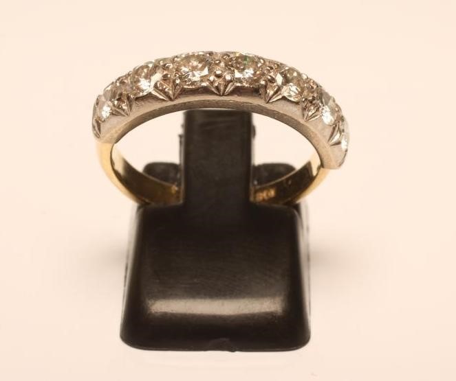 A SEVEN STONE DIAMOND HALF HOOP ETERNITY RING Image