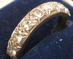 A SEVEN STONE DIAMOND HALF HOOP ETERNITY RING Image
