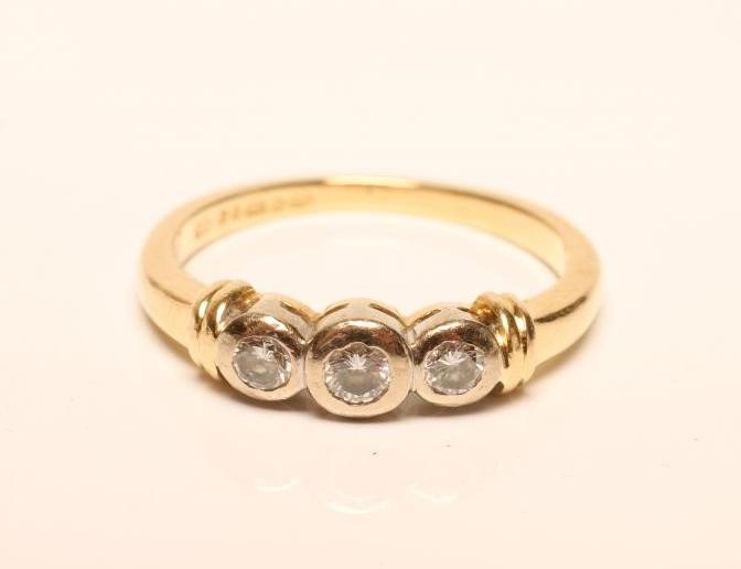 A THREE STONE DIAMOND RING Image