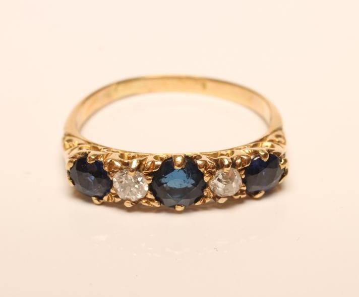 A SAPPHIRE AND DIAMOND FIVE STONE RING Image