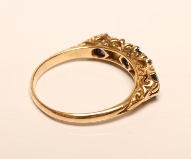 A SAPPHIRE AND DIAMOND FIVE STONE RING Image
