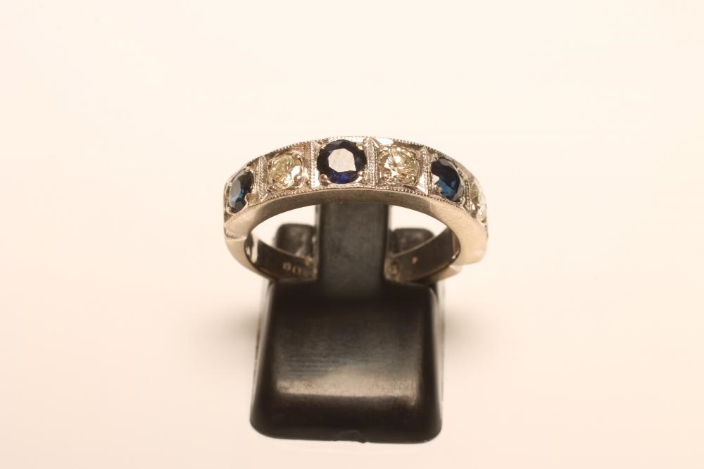 A SAPPHIRE AND DIAMOND HALF HOOP ETERNITY RING Image