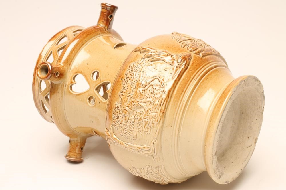 A SALTGLAZE STONEWARE PUZZLE JUG Image