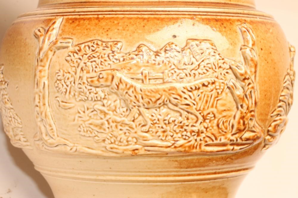 A SALTGLAZE STONEWARE PUZZLE JUG Image