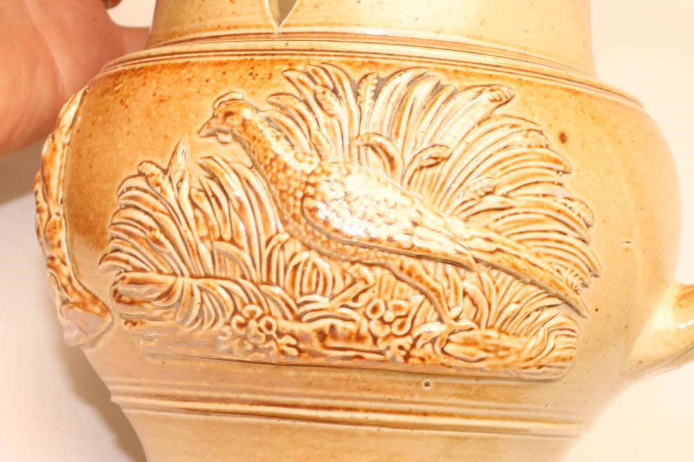 A SALTGLAZE STONEWARE PUZZLE JUG Image