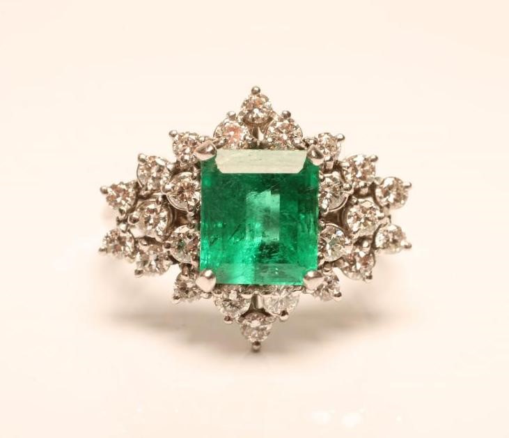 AN EMERALD AND DIAMOND RING Image