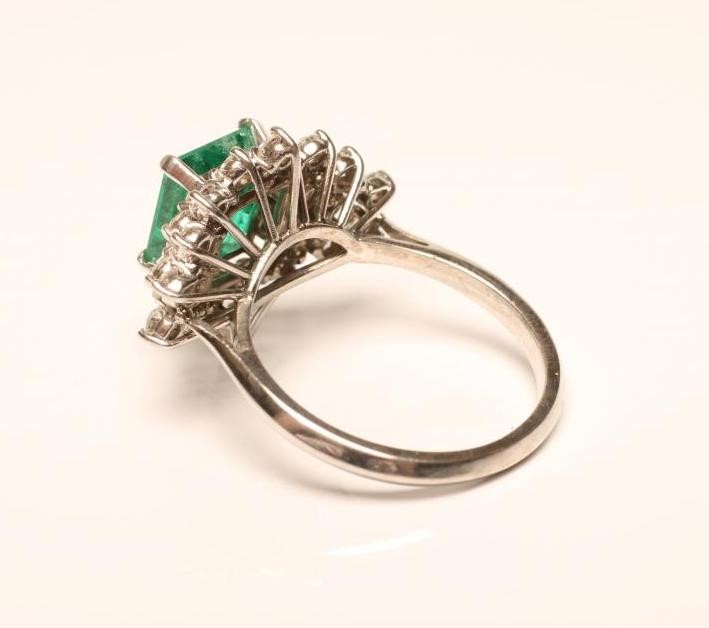 AN EMERALD AND DIAMOND RING Image