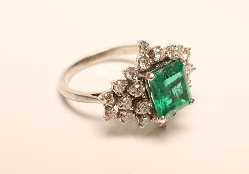 AN EMERALD AND DIAMOND RING Image