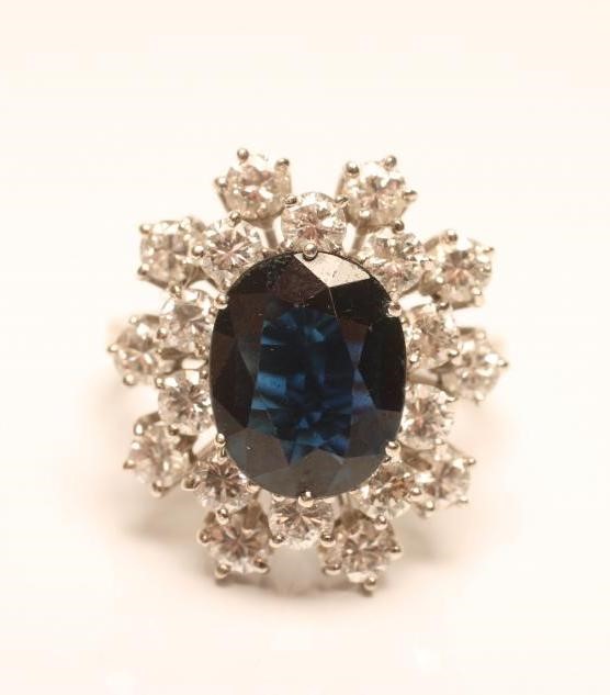 A SAPPHIRE AND DIAMOND CLUSTER RING Image