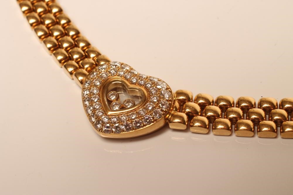 A CHOPARD FLOATING DIAMOND PENDANT AND NECKLACE Image