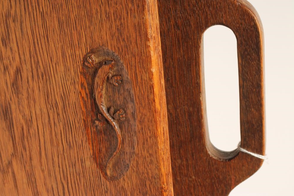 A SMALL OAK MAGAZINE RACK by Martin Dutton Image