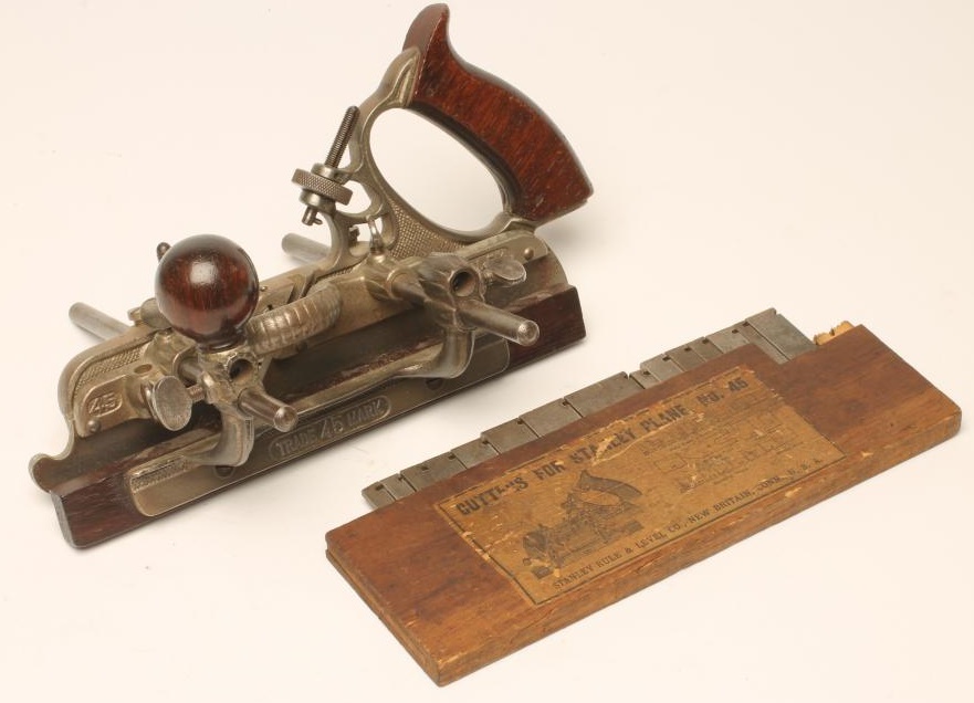 A STANLEY NO 45 PLOUGH PLANE with rosewood handle and knob Image