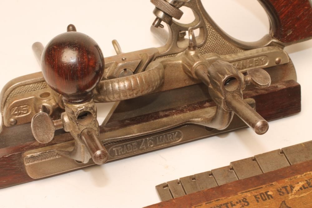 A STANLEY NO 45 PLOUGH PLANE with rosewood handle and knob Image