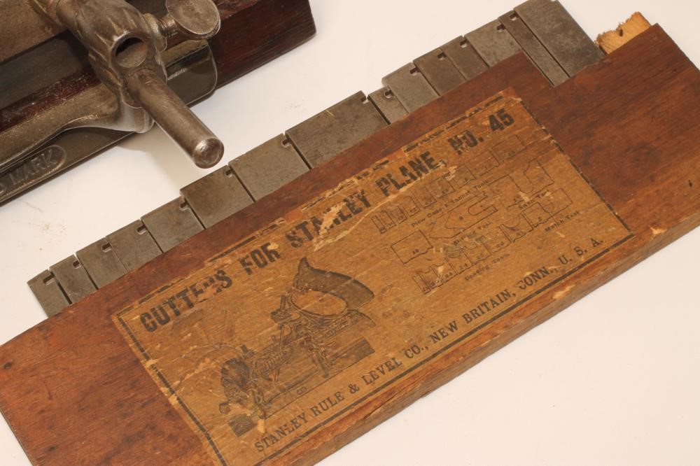 A STANLEY NO 45 PLOUGH PLANE with rosewood handle and knob Image