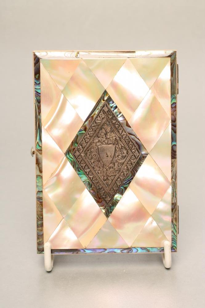 A VICTORIAN VISITING CARD CASE of plain oblong form with mother of pear lozenge inlay Image