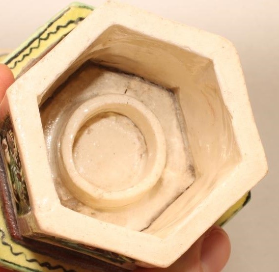 AN EARTHENWARE KANGXI STYLE STAND AND COVER painted in green Image