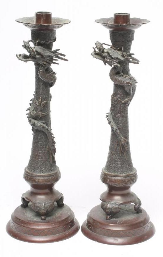 A PAIR OF CHINESE CAST METAL CANDLESTICKS Image