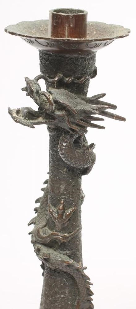 A PAIR OF CHINESE CAST METAL CANDLESTICKS Image