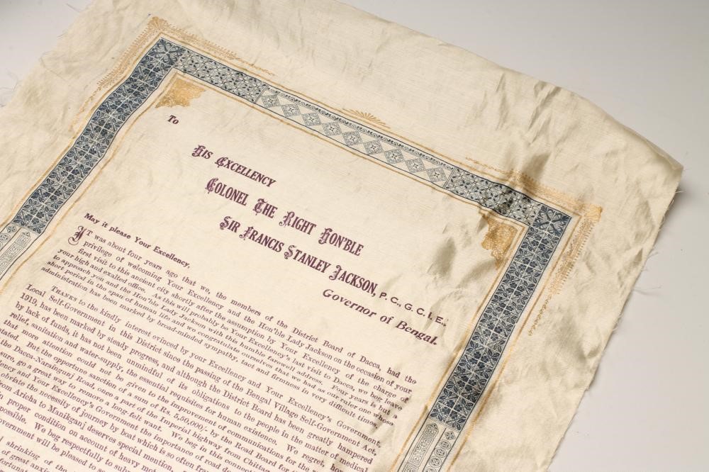 A CREAM SILK PRINTED "FAREWELL" SCROLL from the "Members of the District Board of Dacca" Image