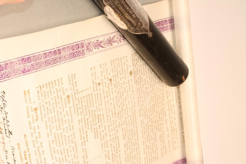 A PRINTED VELLUM "WELCOMING" SCROLL from the "Members of the Indian Merchants Association" Image