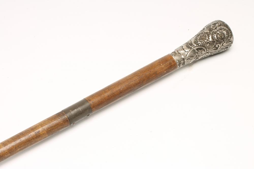 A SILVER TOPPED SWORD STICK Image