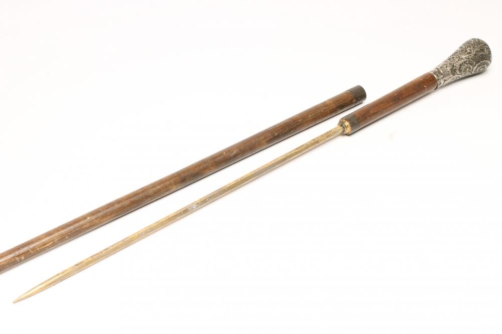 A SILVER TOPPED SWORD STICK Image