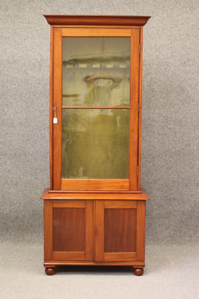 A MAHOGANY GUN CABINET ON CHEST Image