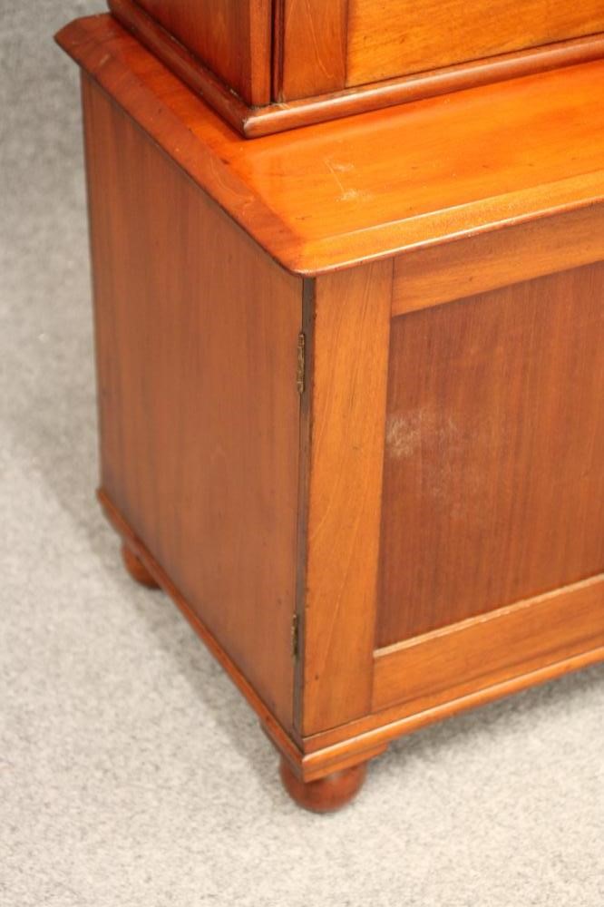 A MAHOGANY GUN CABINET ON CHEST Image