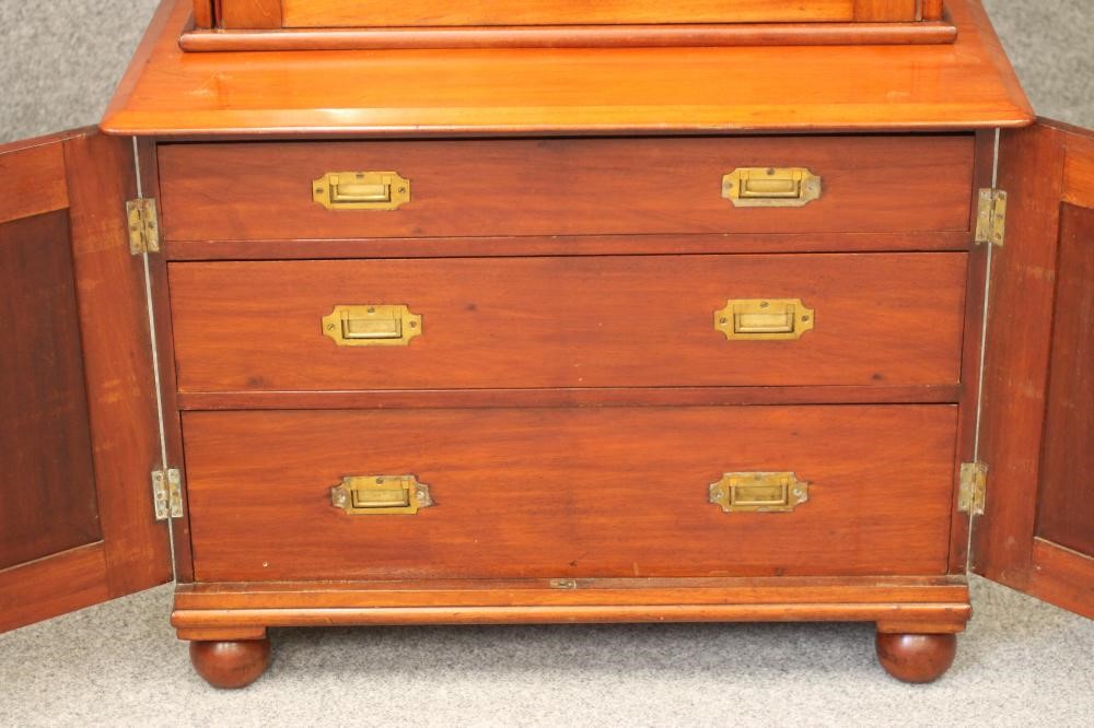 A MAHOGANY GUN CABINET ON CHEST Image