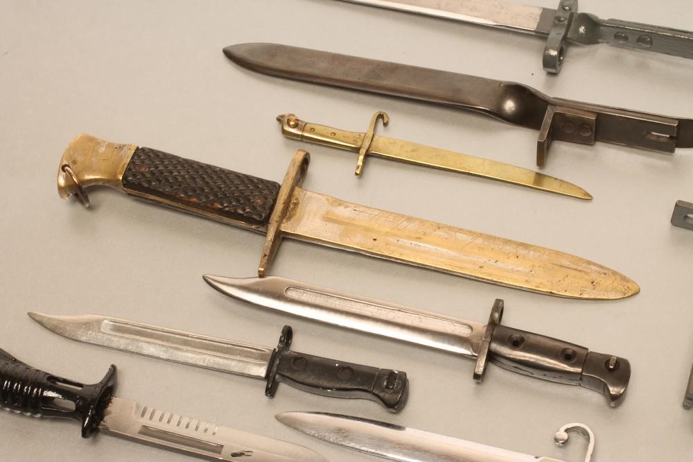 A COLLECTION OF 20TH CENTURY MINIATURE BAYONETS Image