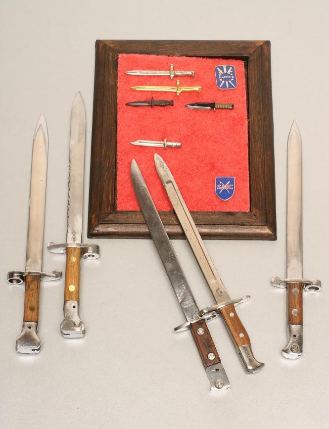 A COLLECTION OF MINIATURE BAYONETS Image