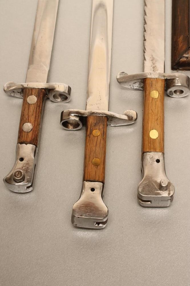 A COLLECTION OF MINIATURE BAYONETS Image