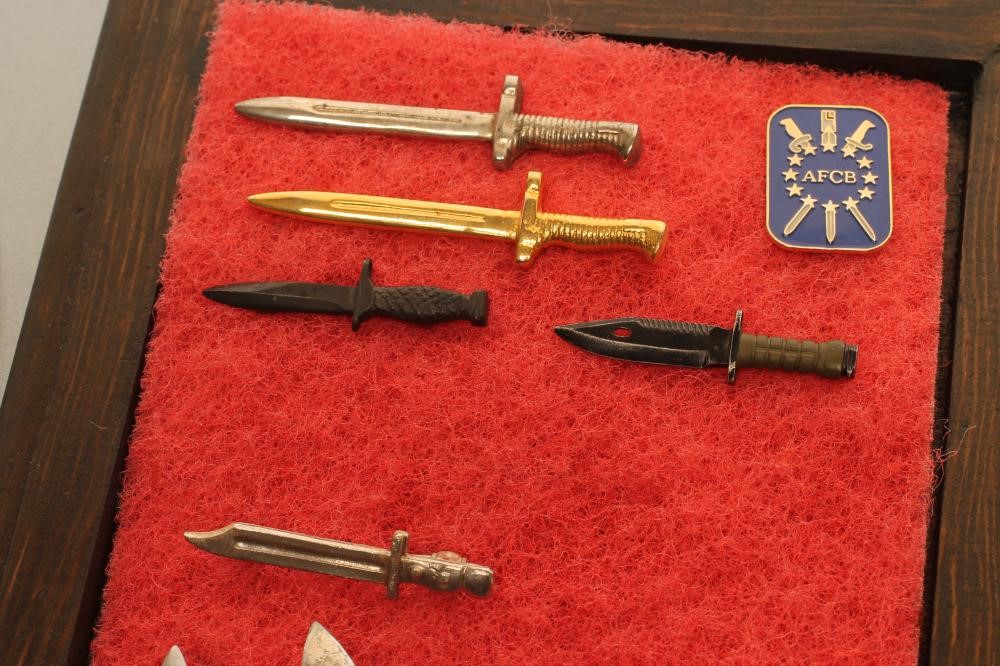 A COLLECTION OF MINIATURE BAYONETS Image