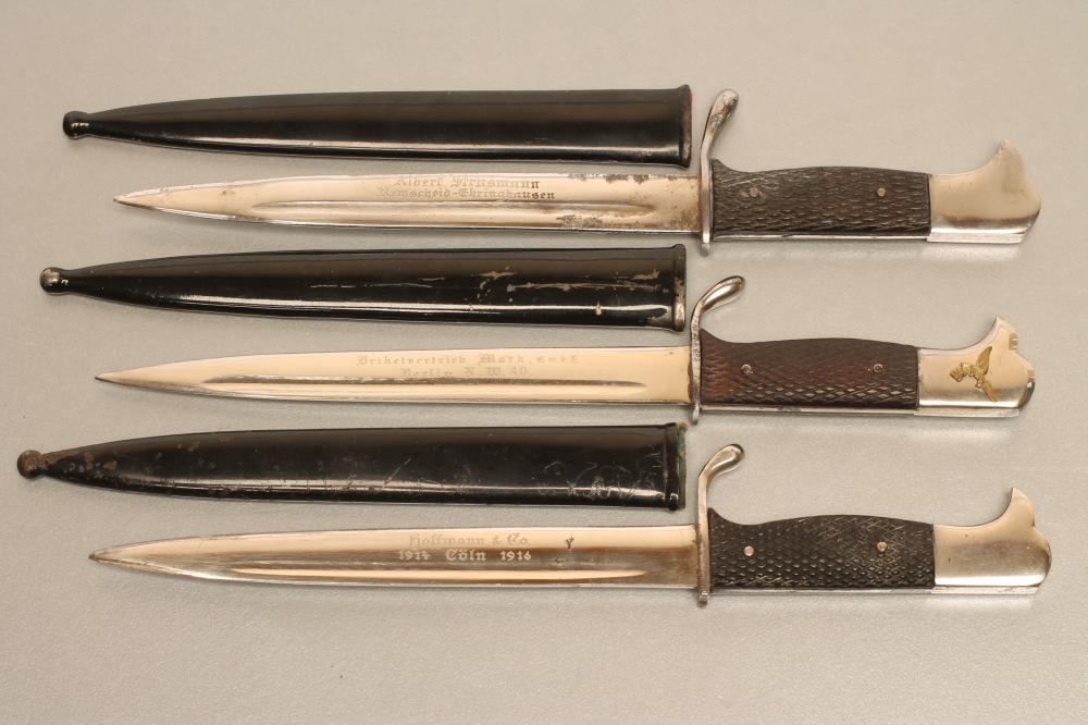 THREE GERMAN SOUVENIR MINIATURE BAYONETS Image