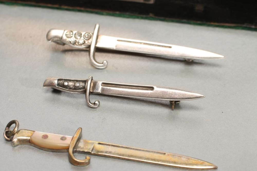 FOUR SILVER MINIATURE BAYONETS Image