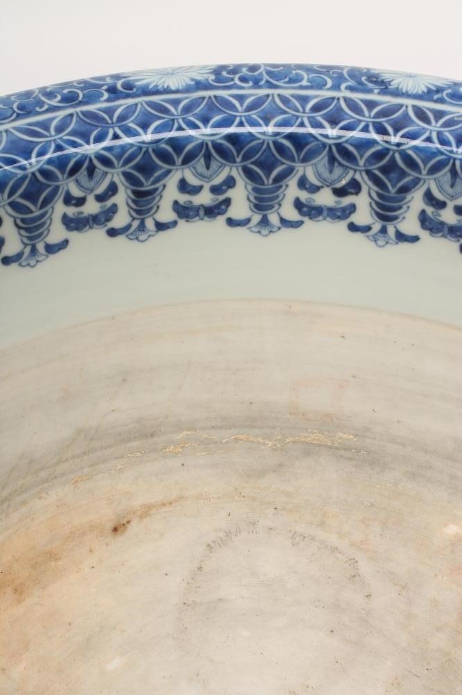 A LARGE CHINESE PORCELAIN BULB PLANTER of plain circular form raised upon three paw feet with mask Image