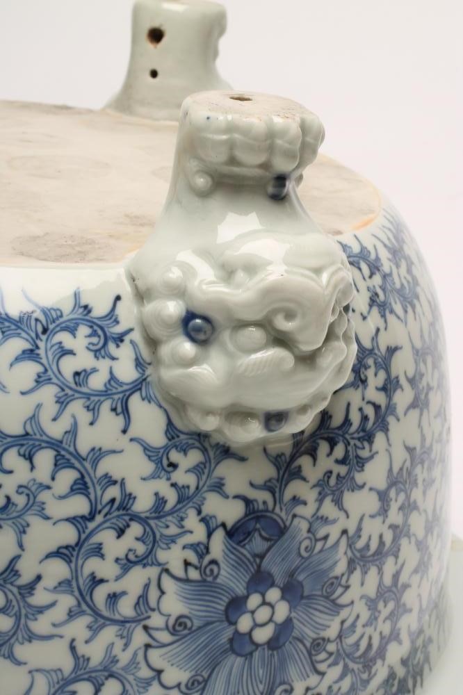 A LARGE CHINESE PORCELAIN BULB PLANTER of plain circular form raised upon three paw feet with mask Image