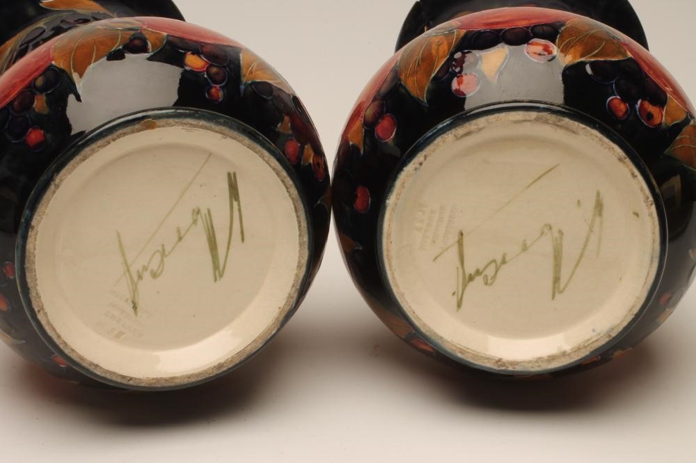 A PAIR OF MOORCROFT POTTERY VASES Image