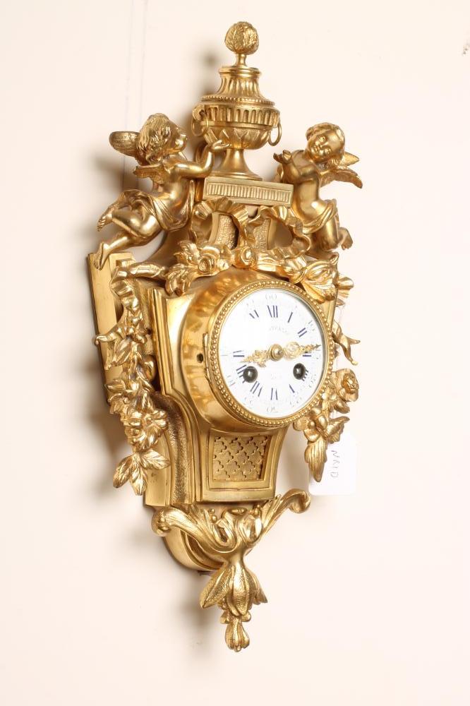 A FRENCH ORMOLU CASED CARTEL CLOCK Image